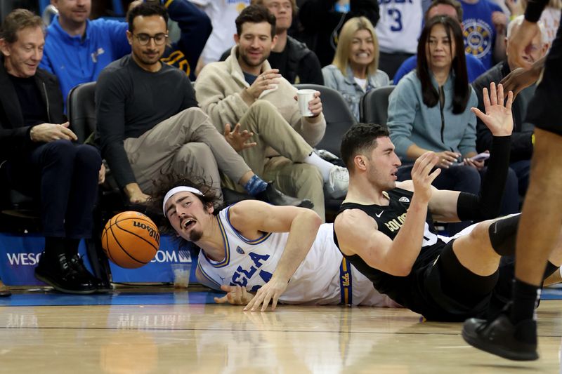 Jan 14, 2023; Los Angeles, California, USA; UCLA Bruins guard Jaime Jaquez Jr. (24) dives for a loose ball during the second half against the Colorado Buffaloes at Pauley Pavilion presented by Wescom. Mandatory Credit: Kiyoshi Mio-USA TODAY Sports