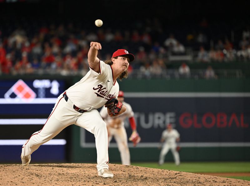 Jul 1, 2024; Washington, District of Columbia, USA; Washington Nationals relief pitcher Hunter Harvey (73) throws a pitch against the New York Mets during the tenth inning at Nationals Park. Mandatory Credit: Rafael Suanes-USA TODAY Sports