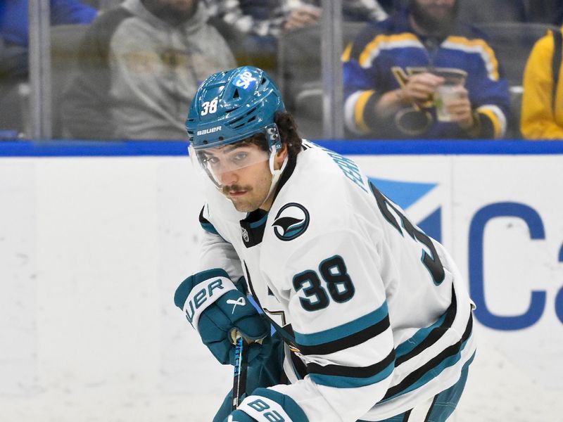 Nov 21, 2024; St. Louis, Missouri, USA;  San Jose Sharks defenseman Mario Ferraro (38) controls the puck against the St. Louis Blues during the second period at Enterprise Center. Mandatory Credit: Jeff Curry-Imagn Images