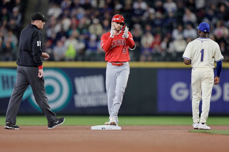 Jun 2, 2024; Seattle, Washington, USA;  Los Angeles Angels designated hitter Taylor Ward (3) celebrates at second after hitting a double against the Seattle Mariners during the first inning at T-Mobile Park. Mandatory Credit: John Froschauer-USA TODAY Sports