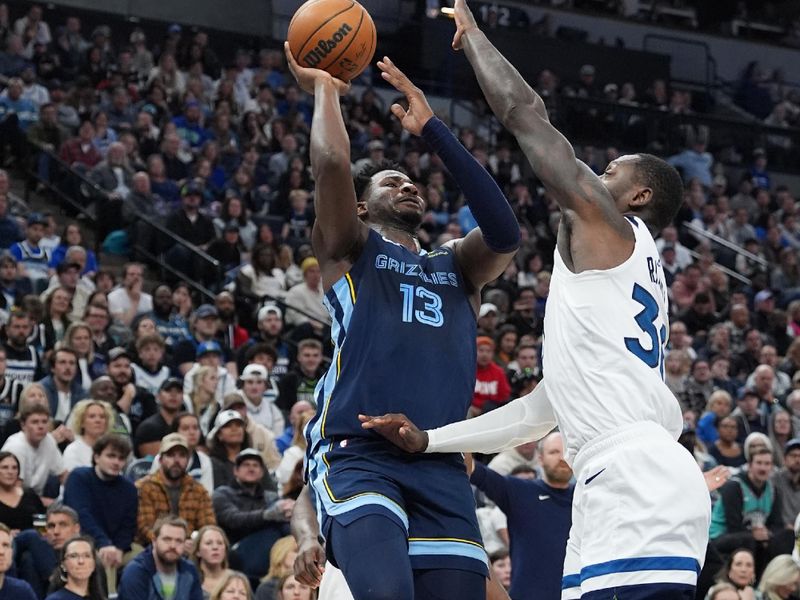 MINNEAPOLIS, MN -  JANUARY 11: Jaren Jackson Jr. #13 of the Memphis Grizzlies drives to the basket during the game against the Minnesota Timberwolves on January 11, 2025 at Target Center in Minneapolis, Minnesota. NOTE TO USER: User expressly acknowledges and agrees that, by downloading and or using this Photograph, user is consenting to the terms and conditions of the Getty Images License Agreement. Mandatory Copyright Notice: Copyright 2025 NBAE (Photo by Jordan Johnson/NBAE via Getty Images)