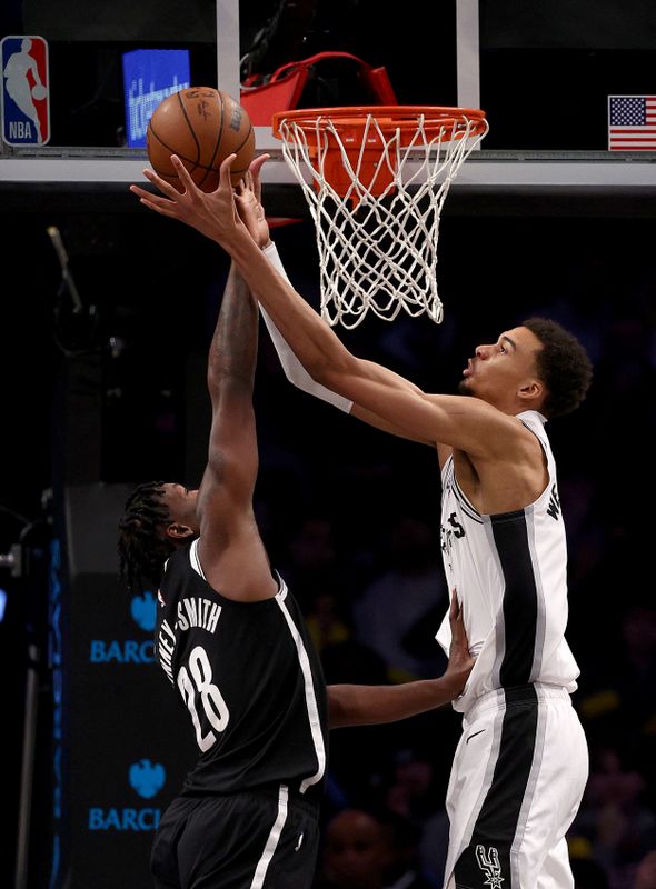 NEW YORK, NEW YORK - FEBRUARY 10: Victor Wembanyama #1 of the San Antonio Spurs heads for the net as Dorian Finney-Smith #28 of the Brooklyn Nets defends  at Barclays Center on February 10, 2024 in the Brooklyn borough of New York City. The Brooklyn Nets defeated the San Antonio Spurs 123-103. NOTE TO USER: User expressly acknowledges and agrees that, by downloading and or using this photograph, User is consenting to the terms and conditions of the Getty Images License Agreement. (Photo by Elsa/Getty Images)