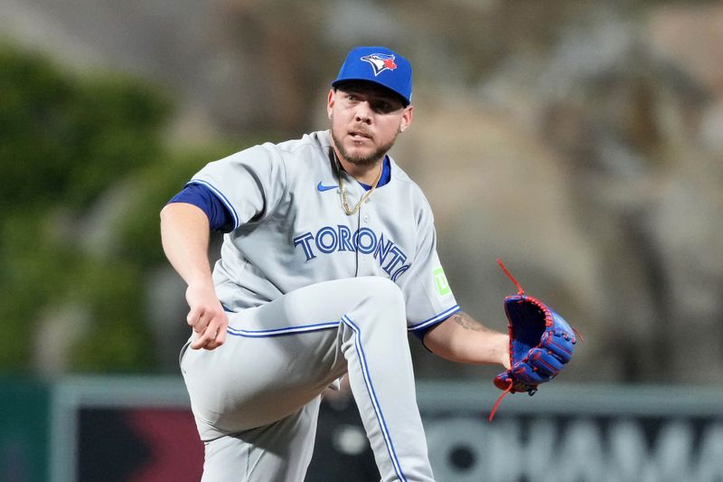 May 8, 2025; Anaheim, California, USA; Toronto Blue Jays relief pitcher Yariel Rodriguez (29) reacts in the eighth inning against the Los Angeles Angels at Angel Stadium. Mandatory Credit: Kirby Lee-Imagn Images