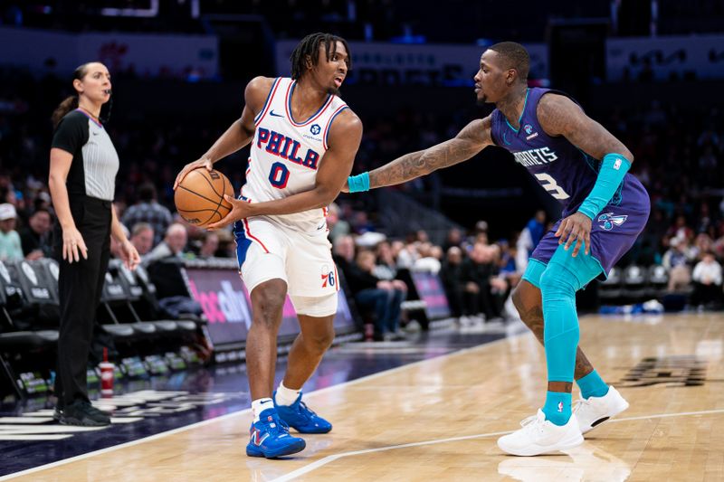 CHARLOTTE, NORTH CAROLINA - JANUARY 20: Terry Rozier #3 of the Charlotte Hornets guards Tyrese Maxey #0 of the Philadelphia 76ers in the third quarter during their game at Spectrum Center on January 20, 2024 in Charlotte, North Carolina. NOTE TO USER: User expressly acknowledges and agrees that, by downloading and or using this photograph, User is consenting to the terms and conditions of the Getty Images License Agreement. (Photo by Jacob Kupferman/Getty Images)