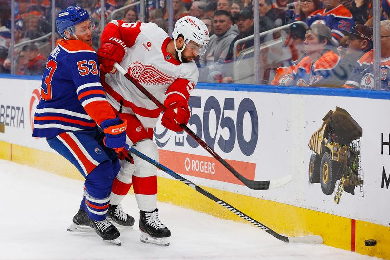 Jan 30, 2025; Edmonton, Alberta, CAN; Edmonton Oilers forward Jeff Skinner (53) and Detroit Red Wings defensemen Erik Gustafsson (56) battle along the boards for a loose puck  during the first period at Rogers Place. Mandatory Credit: Perry Nelson-Imagn Images