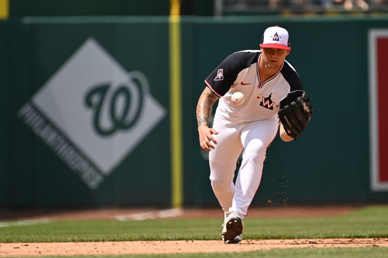 May 26, 2024; Washington, District of Columbia, USA; Washington Nationals third baseman Nick Senzel (13) fields a ground ball against the Seattle Mariners during the fourth inning at Nationals Park. Mandatory Credit: Rafael Suanes-USA TODAY Sports
