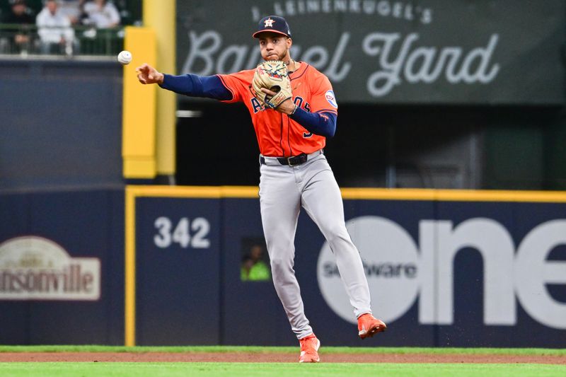 May 7, 2025; Milwaukee, Wisconsin, USA; Houston Astros shortstop Jeremy Pena (3) throws out Milwaukee Brewers left fielder Isaac Collins (not pictured) in the first inning at American Family Field. Mandatory Credit: Benny Sieu-Imagn Images