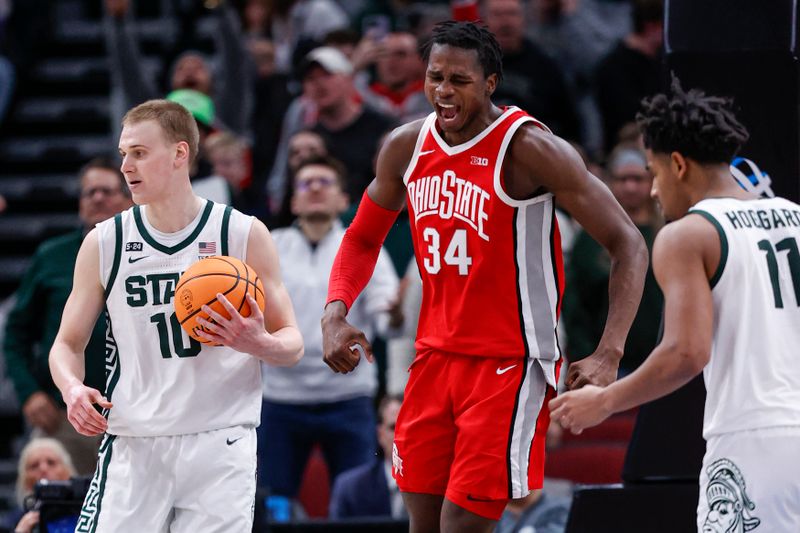 Mar 10, 2023; Chicago, IL, USA; Ohio State Buckeyes center Felix Okpara (34) reacts after scoring against the Michigan State Spartans during the second half at United Center. Mandatory Credit: Kamil Krzaczynski-USA TODAY Sports