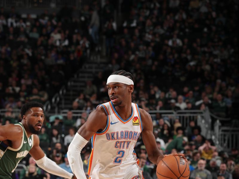 MILWAUKEE, WI - MARCH 24: Shai Gilgeous-Alexander #2 of the Oklahoma City Thunder handles the ball during the game against the Milwaukee Bucks on March 24, 2024 at the Fiserv Forum Center in Milwaukee, Wisconsin. NOTE TO USER: User expressly acknowledges and agrees that, by downloading and or using this Photograph, user is consenting to the terms and conditions of the Getty Images License Agreement. Mandatory Copyright Notice: Copyright 2024 NBAE (Photo by Gary Dineen/NBAE via Getty Images).