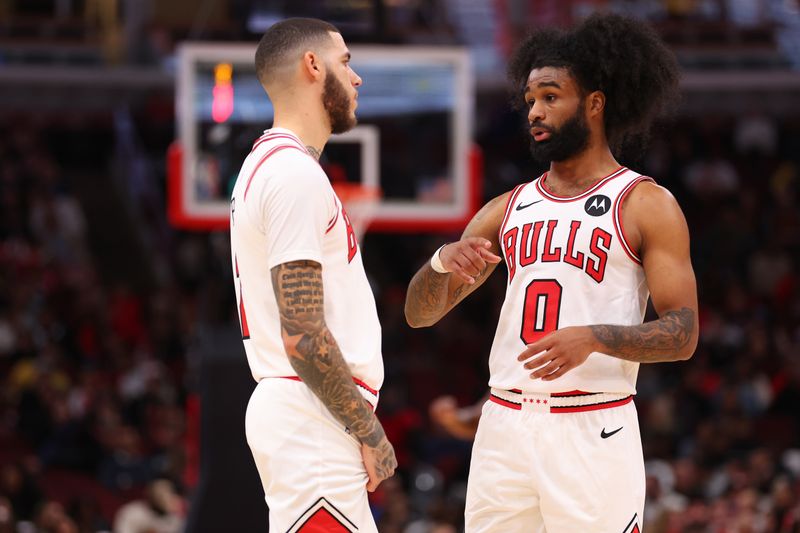 CHICAGO, ILLINOIS - OCTOBER 18: Lonzo Ball #2 and Coby White #0 of the Chicago Bulls talk against the Cleveland Cavaliers during the first half of a preseason game at the United Center on October 18, 2024 in Chicago, Illinois. NOTE TO USER: User expressly acknowledges and agrees that, by downloading and or using this photograph, User is consenting to the terms and conditions of the Getty Images License Agreement.  (Photo by Michael Reaves/Getty Images)