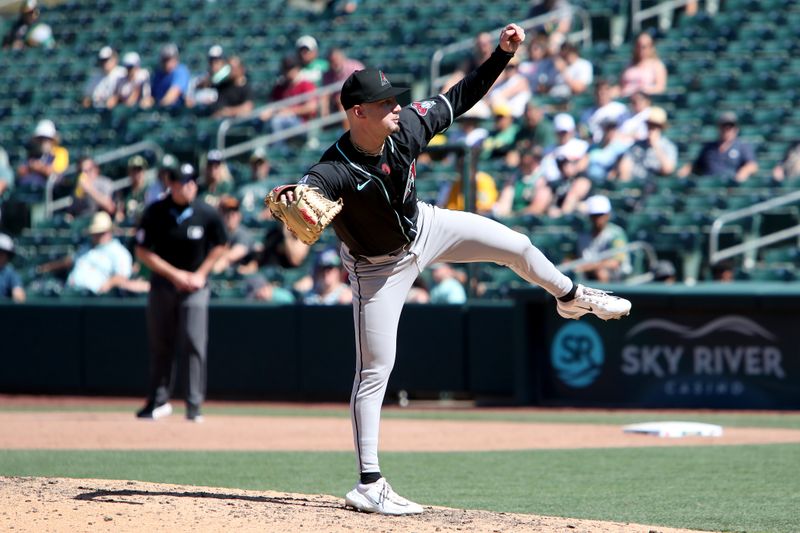Aug 3, 2025; West Sacramento, California, USA; Arizona Diamondbacks pitcher Kyle Nelson (24) throws a pitch against the Athletics during the ninth inning at Sutter Health Park. Mandatory Credit: Dennis Lee-Imagn Images
