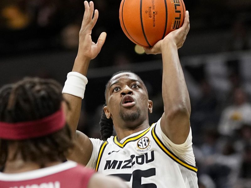 Jan 31, 2024; Columbia, Missouri, USA; Missouri Tigers guard Sean East II (55) shots against Arkansas Razorbacks forward Chandler Lawson (8) during the first half at Mizzou Arena. Mandatory Credit: Jay Biggerstaff-USA TODAY Sports