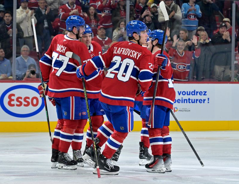 Oct 14, 2024; Montreal, Quebec, CAN; Montreal Canadiens forward Juraj Slafkovsky (20) celebrates with teammates after scoring a goal against the Pittsburgh Penguins during the second period at the Bell Centre. Mandatory Credit: Eric Bolte-Imagn Images