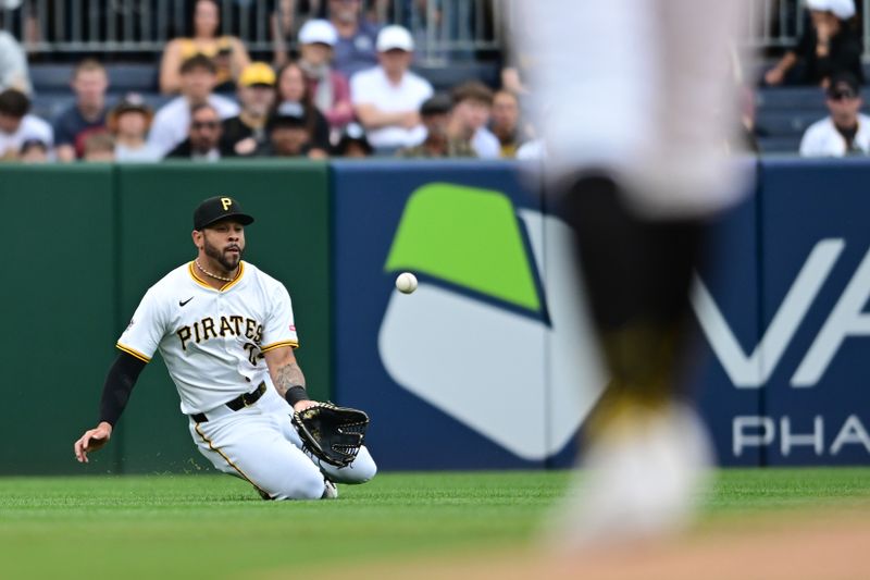 May 4, 2025; Pittsburgh, Pennsylvania, USA; Pittsburgh Pirates left fielder Tommy Pham (28) dives to catch a ball during the fourth inning against the San Diego Padres at PNC Park. Mandatory Credit: David Dermer-Imagn Images