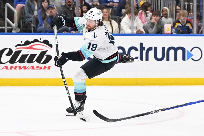 Apr 14, 2024; St. Louis, Missouri, USA; Seattle Kraken left wing Jared McCann (19) shoots the puck against the St. Louis Blues during the first period at Enterprise Center. Mandatory Credit: Jeff Le-USA TODAY Sports