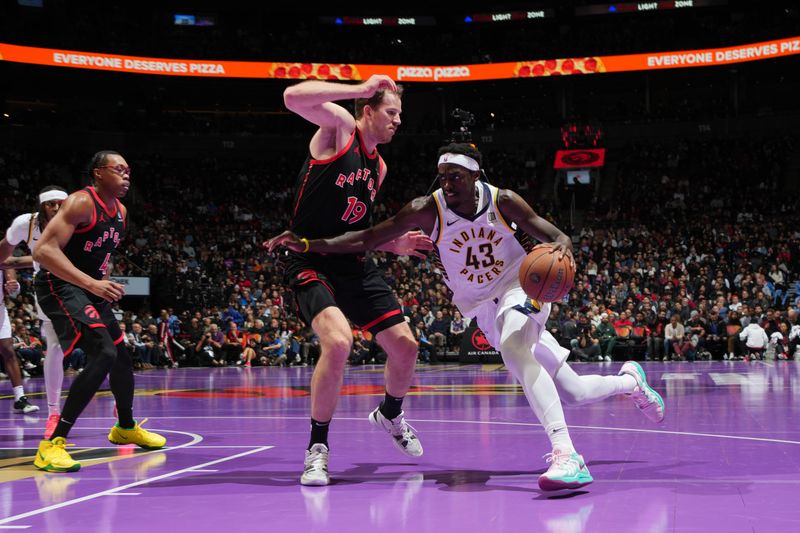 TORONTO, CANADA - DECEMBER 3: Pascal Siakam #43 of the Indiana Pacers handles the ball during the game against the Toronto Raptors during the Emirates NBA Cup game on December 3, 2024 at the Scotiabank Arena in Toronto, Ontario, Canada.  NOTE TO USER: User expressly acknowledges and agrees that, by downloading and or using this Photograph, user is consenting to the terms and conditions of the Getty Images License Agreement.  Mandatory Copyright Notice: Copyright 2024 NBAE (Photo by Mark Blinch/NBAE via Getty Images)