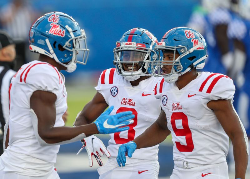 Oct 3, 2020; Lexington, Kentucky, USA; Mississippi Rebels wide receiver Elijah Moore (8) celebrates after a Mississippi touchdown in the second half against Kentucky at Kroger Field. Mandatory Credit: Katie Stratman-USA TODAY Sports