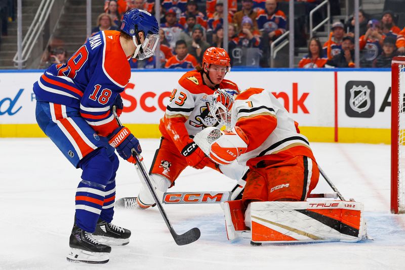 Jan 3, 2025; Edmonton, Alberta, CAN; Anaheim Ducks goaltender Lucas Dostal (1) makes a save on Edmonton Oilers forward Zach Hyman (18) during the third period at Rogers Place. Mandatory Credit: Perry Nelson-Imagn Images