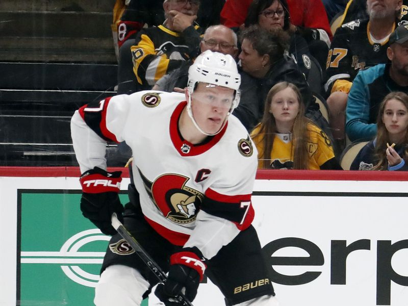 Oct 28, 2023; Pittsburgh, Pennsylvania, USA; Ottawa Senators left wing Brady Tkachuk (7) handles the puck against the Pittsburgh Penguins during the second period at PPG Paints Arena. Mandatory Credit: Charles LeClaire-USA TODAY Sports