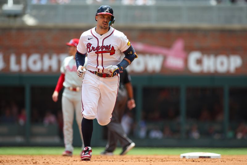 Jul 7, 2024; Atlanta, Georgia, USA; Atlanta Braves right fielder Adam Duvall (14) runs to third after a home run against the Philadelphia Phillies in the second inning at Truist Park. Mandatory Credit: Brett Davis-USA TODAY Sports