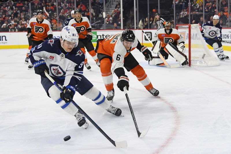 Mar 6, 2025; Philadelphia, Pennsylvania, USA;  Winnipeg Jets center Cole Perfetti (91) and Philadelphia Flyers defenseman Travis Sanheim (6) battle for the puck during the second period at Wells Fargo Center. Mandatory Credit: Eric Hartline-Imagn Images