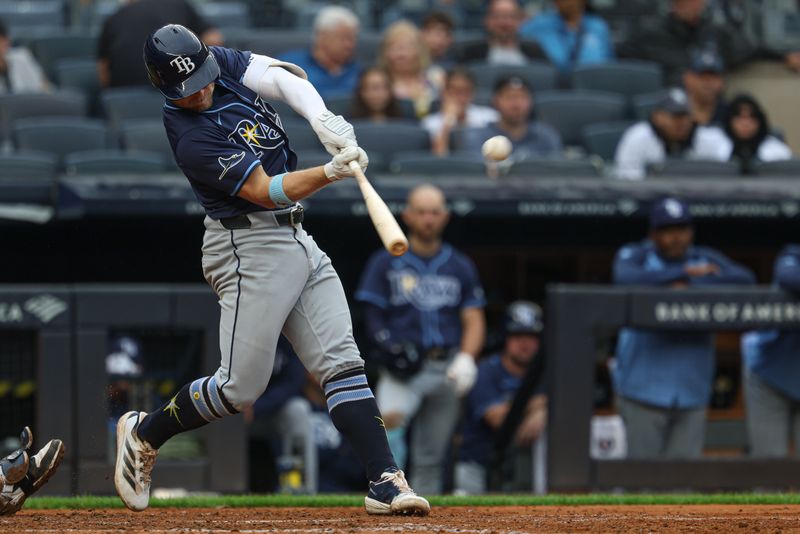 May 4, 2025; Bronx, New York, USA; Tampa Bay Rays shortstop Taylor Walls (6) doubles during the fifth inning against the New York Yankees at Yankee Stadium. Mandatory Credit: Vincent Carchietta-Imagn Images