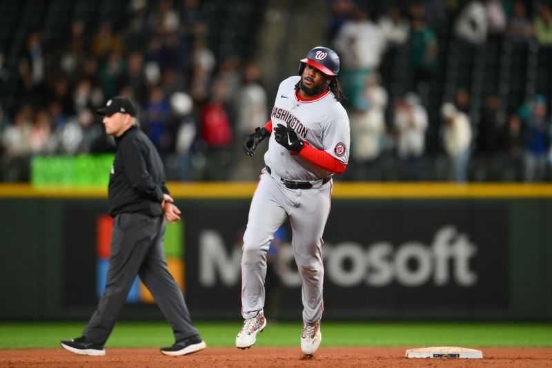 May 29, 2025; Seattle, Washington, USA; Washington Nationals designated hitter Josh Bell (19) runs the bases after hitting a 2-run home run against Seattle Mariners during the tenth inning at T-Mobile Park. Mandatory Credit: Steven Bisig-Imagn Images