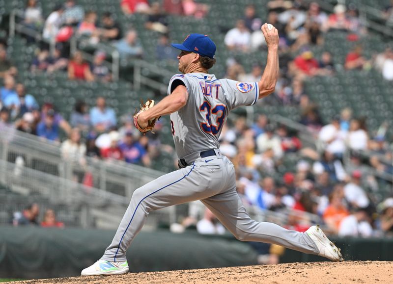 Sep 10, 2023; Minneapolis, Minnesota, USA; New York Mets relief pitcher Trevor Gott (33) delivers a pitch against the Minnesota Twins in the eighth inning at Target Field. Mandatory Credit: Michael McLoone-USA TODAY Sports