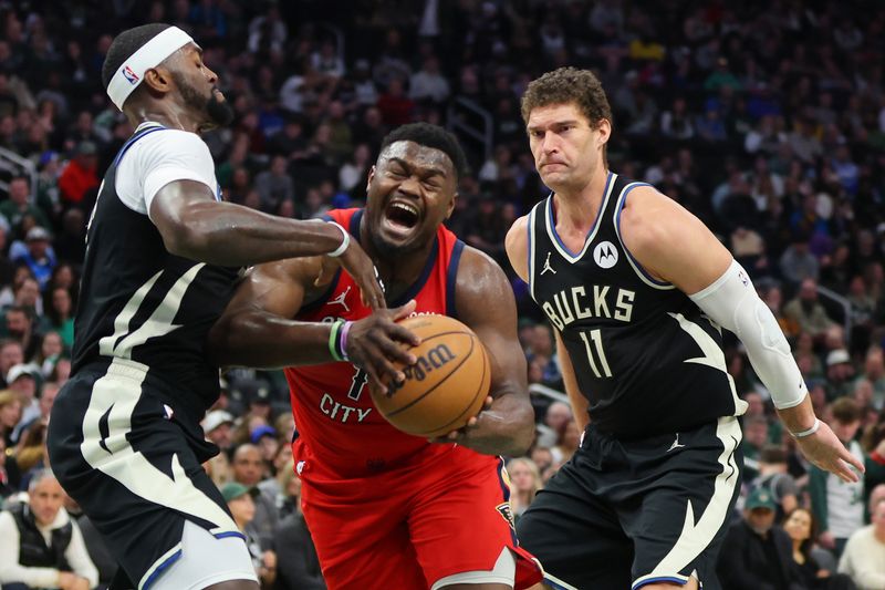 MILWAUKEE, WISCONSIN - JANUARY 27: Zion Williamson #1 of the New Orleans Pelicans drives to the basket against Bobby Portis #9 of the Milwaukee Bucks during the first half of a game at Fiserv Forum on January 27, 2024 in Milwaukee, Wisconsin. NOTE TO USER: User expressly acknowledges and agrees that, by downloading and or using this photograph, User is consenting to the terms and conditions of the Getty Images License Agreement. (Photo by Stacy Revere/Getty Images)