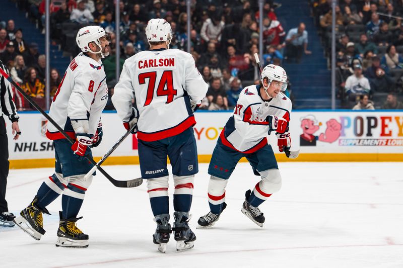 Jan 21, 2026; Vancouver, British Columbia, CAN; Washington Capitals forward Alex Ovechkin (8) and defenseman John Carlson (74) and forward Dylan Strome (17) celebrate Strome’s goal against the Vancouver Canucks in the first period at Rogers Arena. Mandatory Credit: Bob Frid-Imagn Images