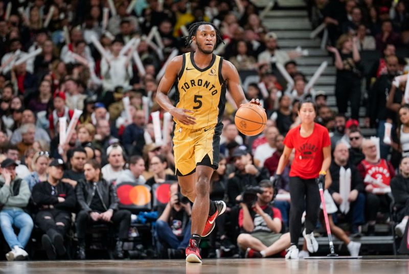 TORONTO, ON - APRIL 7: Immanuel Quickley #5 of the Toronto Raptors dribbles against the Washington Wizards during the second half of their basketball game at the Scotiabank Arena on April 7, 2024 in Toronto, Ontario, Canada. NOTE TO USER: User expressly acknowledges and agrees that, by downloading and/or using this Photograph, user is consenting to the terms and conditions of the Getty Images License Agreement. (Photo by Mark Blinch/Getty Images)