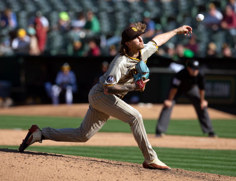 Sep 16, 2023; Oakland, California, USA; San Diego Padres pitcher Josh Hader (71) delivers a pitch against the Oakland Athletics during the ninth inning at Oakland-Alameda County Coliseum. Mandatory Credit: D. Ross Cameron-USA TODAY Sports