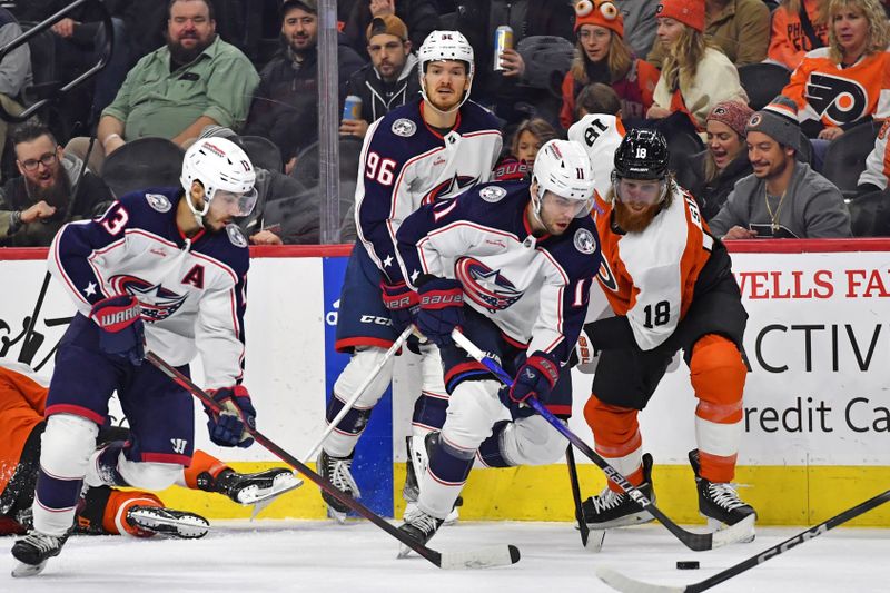 Jan 4, 2024; Philadelphia, Pennsylvania, USA; Columbus Blue Jackets center Adam Fantilli (11) and Philadelphia Flyers defenseman Marc Staal (18) battle for the puck during the second period at Wells Fargo Center. Mandatory Credit: Eric Hartline-USA TODAY Sports