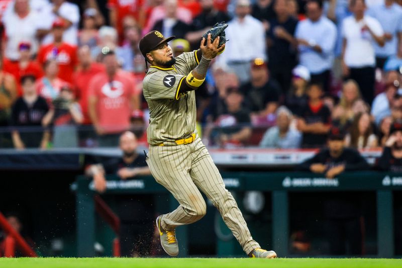 Jun 27, 2025; Cincinnati, Ohio, USA; San Diego Padres first baseman Luis Arraez (4) catches a pop up hit by Cincinnati Reds outfielder Will Benson (not pictured) in the fifth inning at Great American Ball Park. Mandatory Credit: Katie Stratman-Imagn Images