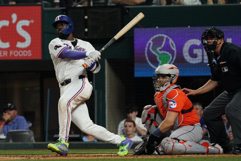 May 15, 2025; Arlington, Texas, USA; Texas Rangers outfielder Adolis García (53) hits a double during the fifth inning against the Houston Astros at Globe Life Field. Mandatory Credit: Raymond Carlin III-Imagn Images