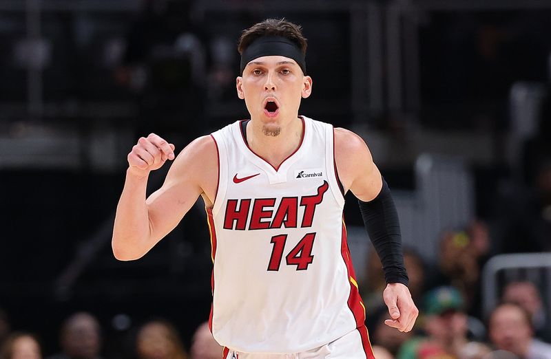 ATLANTA, GEORGIA - APRIL 09:  Tyler Herro #14 of the Miami Heat reacts after a basket against the Atlanta Hawks during the second overtime at State Farm Arena on April 09, 2024 in Atlanta, Georgia.  NOTE TO USER: User expressly acknowledges and agrees that, by downloading and/or using this photograph, user is consenting to the terms and conditions of the Getty Images License Agreement.  (Photo by Kevin C. Cox/Getty Images)