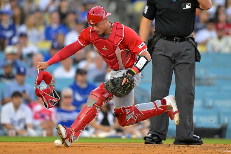 Jun 21, 2024; Los Angeles, California, USA;  Los Angeles Angels catcher Logan O'Hoppe (14) chases down a wild pitch in the third inning against the Los Angeles Dodgers at Dodger Stadium. Mandatory Credit: Jayne Kamin-Oncea-USA TODAY Sports