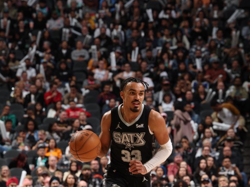 SAN ANTONIO, TX - JANUARY 27: Tre Jones #33 of the San Antonio Spurs brings the ball up court against the Minnesota Timberwolves on January 27, 2024 at the Frost Bank Center in San Antonio, Texas. NOTE TO USER: User expressly acknowledges and agrees that, by downloading and or using this photograph, user is consenting to the terms and conditions of the Getty Images License Agreement. Mandatory Copyright Notice: Copyright 2024 NBAE (Photos by David Sherman/NBAE via Getty Images)