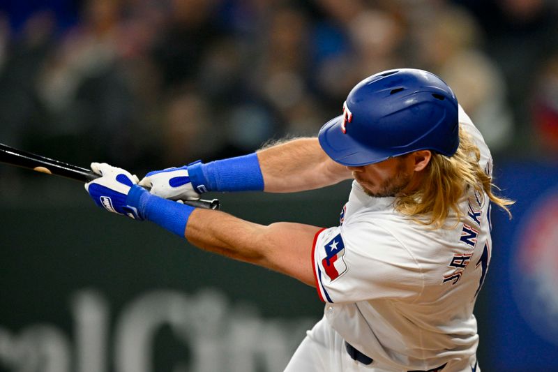 May 2, 2024; Arlington, Texas, USA; Texas Rangers designated hitter Travis Jankowski (16) singles and drives in two runs against the Washington Nationals during the eighth inning at Globe Life Field. Mandatory Credit: Jerome Miron-USA TODAY Sports