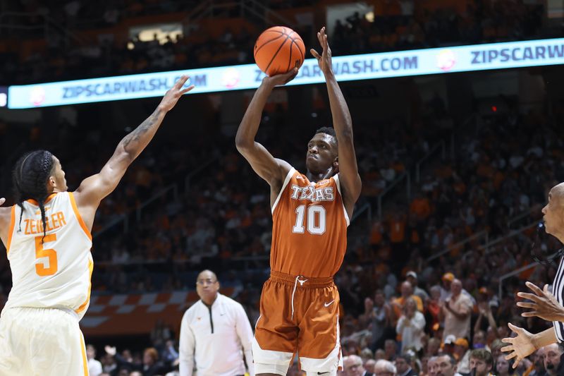 Jan 28, 2023; Knoxville, Tennessee, USA; Texas Longhorns guard Sir'Jabari Rice (10) shoots the ball against Tennessee Volunteers guard Zakai Zeigler (5) during the second half at Thompson-Boling Arena. Mandatory Credit: Randy Sartin-USA TODAY Sports