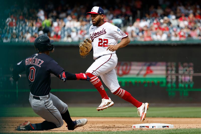 Apr 16, 2023; Washington, District of Columbia, USA; Washington Nationals first baseman Dominic Smith (22) touches first base after fielding a ground ball by Cleveland Guardians second baseman Andres Gimenez (0) during the sixth inning at Nationals Park. Mandatory Credit: Geoff Burke-USA TODAY Sports