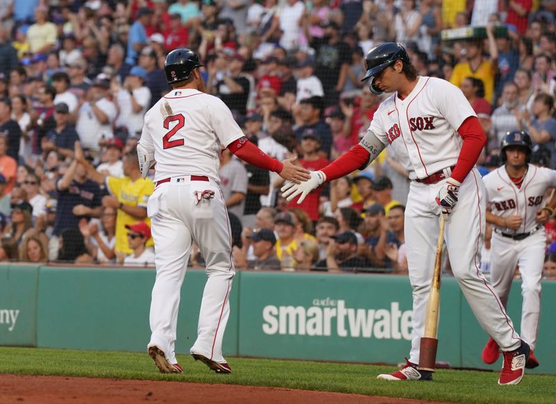 Jul 23, 2023; Boston, Massachusetts, USA; Boston Red Sox designated hitter Justin Turner (2) is congratulated by first baseman Triston Casas (36) after scoring against the New York Mets in the first inning at Fenway Park. Mandatory Credit: David Butler II-USA TODAY Sports