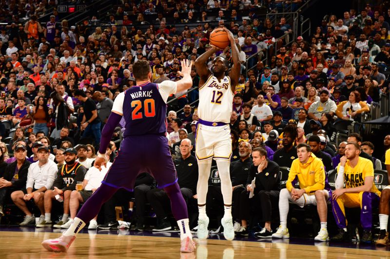 PHOENIX, AZ - FEBRUARY 25: Taurean Prince #12 of the Los Angeles Lakers shoots a three point basket against the Phoenix Suns on February 25, 2024 at Footprint Center in Phoenix, Arizona. NOTE TO USER: User expressly acknowledges and agrees that, by downloading and or using this photograph, user is consenting to the terms and conditions of the Getty Images License Agreement. Mandatory Copyright Notice: Copyright 2024 NBAE (Photo by Kate Frese/NBAE via Getty Images)