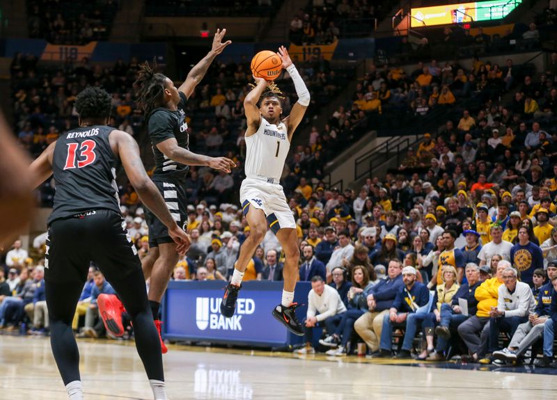 Jan 31, 2024; Morgantown, West Virginia, USA; West Virginia Mountaineers guard Noah Farrakhan (1) shoots a jumper during the second half against the Cincinnati Bearcats at WVU Coliseum. Mandatory Credit: Ben Queen-USA TODAY Sports