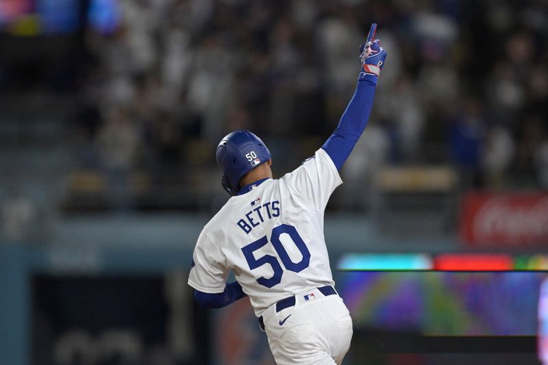 Apr 2, 2024; Los Angeles, California, USA; Los Angeles Dodgers shortstop Mookie Betts (50) rounds the bases after hitting a solo home run for his 1500th career hit in the third inning against the San Francisco Giants at Dodger Stadium. Mandatory Credit: Jayne Kamin-Oncea-USA TODAY Sports