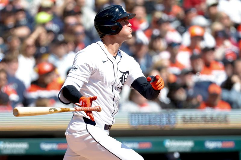 Apr 6, 2024; Detroit, Michigan, USA;  Detroit Tigers right fielder Kerry Carpenter (30) hits a double against the Oakland Athletics in the first inning at Comerica Park. Mandatory Credit: Rick Osentoski-USA TODAY Sports