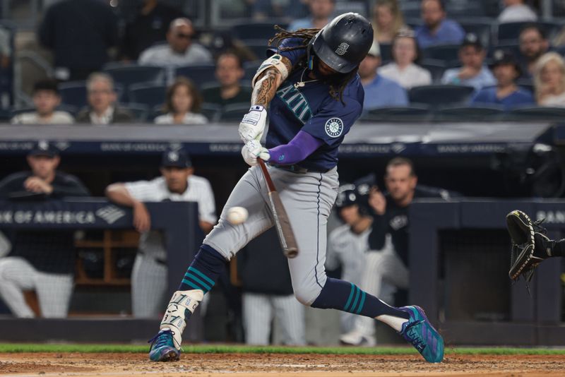 May 21, 2024; Bronx, New York, USA; Seattle Mariners shortstop J.P. Crawford (3) singles during the fifth inning against the New York Yankees at Yankee Stadium. Mandatory Credit: Vincent Carchietta-USA TODAY Sports