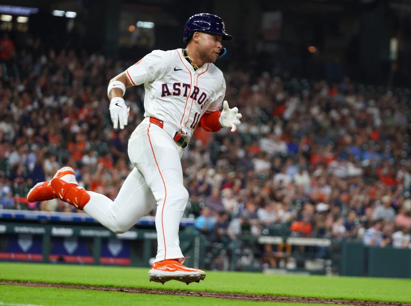 May 29, 2025; Houston, Texas, USA; Houston Astros right fielder Cam Smith (11) hits a double against the Tampa Bay Rays in the fifth inning at Daikin Park. Mandatory Credit: Thomas Shea-Imagn Images
