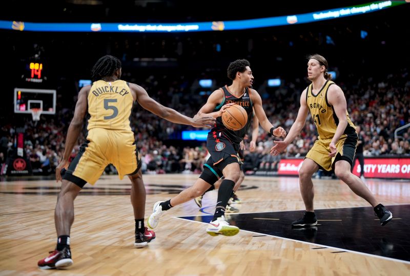 TORONTO, ON - APRIL 7: Jordan Poole #13 of the Washington Wizards dribbles against Immanuel Quickley #5 and Kelly Olynyk #41 of the Toronto Raptors during the first half of their basketball game at the Scotiabank Arena on April 7, 2024 in Toronto, Ontario, Canada. NOTE TO USER: User expressly acknowledges and agrees that, by downloading and/or using this Photograph, user is consenting to the terms and conditions of the Getty Images License Agreement. (Photo by Mark Blinch/Getty Images)