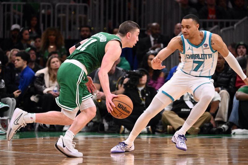 BOSTON, MASSACHUSETTS - APRIL 12: Payton Pritchard #11 of the Boston Celtics drives to the basket against Bryce McGowens #7 of the Charlotte Hornets during the third quarter at the TD Garden on April 12, 2024 in Boston, Massachusetts. NOTE TO USER: User expressly acknowledges and agrees that, by downloading and or using this photograph, User is consenting to the terms and conditions of the Getty Images License Agreement. (Photo by Brian Fluharty/Getty Images)